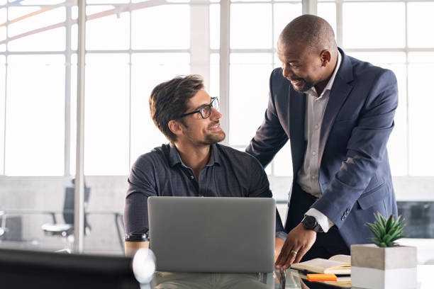 istock Mature executive helping new employee 1189302346