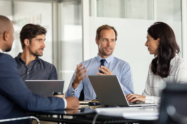 istock Multiethnic business people in meeting 1189303432