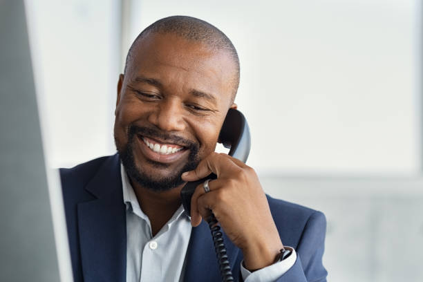 istock Mature black business man talking on phone 1189303602