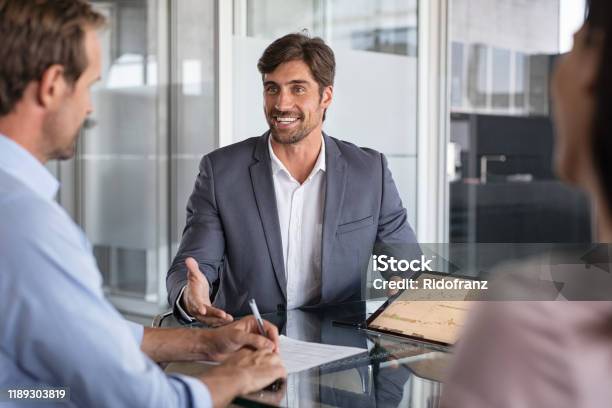 Financial Advisor Consulting Stock Photo - Download Image Now - Insurance Agent, Financial Advisor, Business