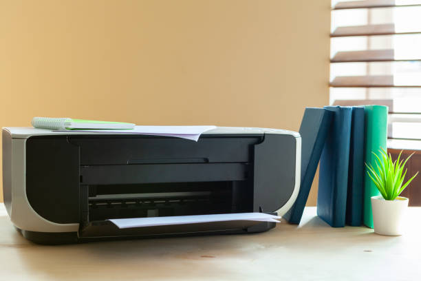 istock Close up of an office table with printer on it 1189306925
