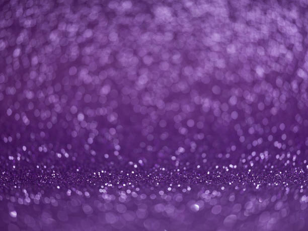 istock abstract purple glitter bokeh lights 1189308797