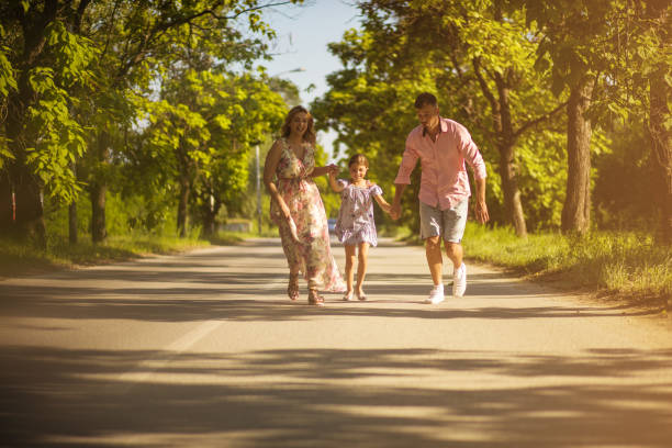 istock Parents with daughter in nature. 1189314736