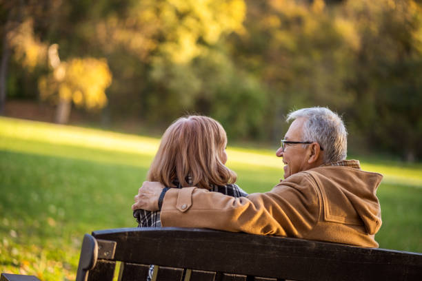 istock Senior couple in park in autumn 1189314745