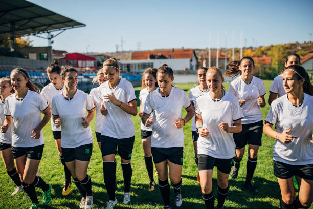 istock Women soccer team warming up together 1189314751