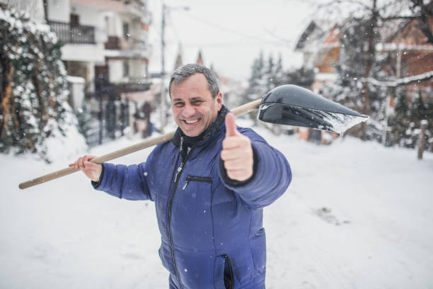 An elderly man was clearing snow