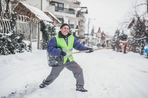 An old man is happy about clearing snow