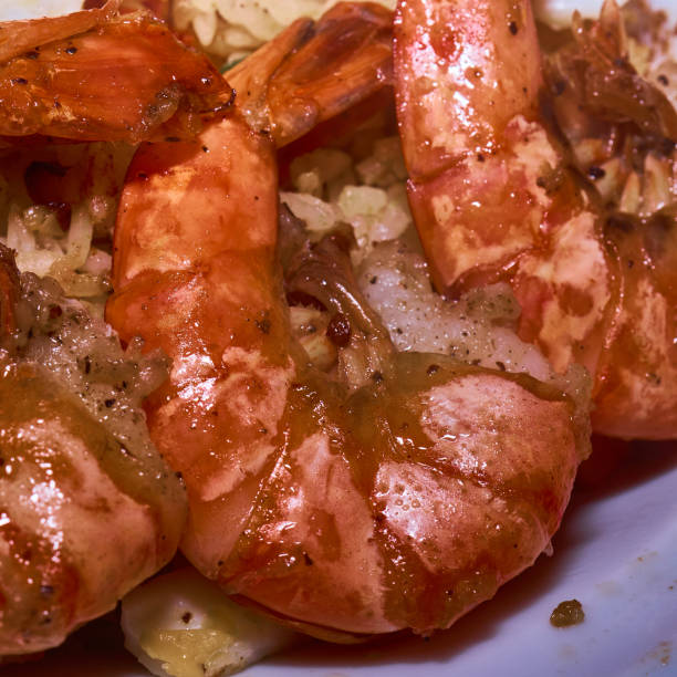 Close-up of grilled red shrimp tails on a plate