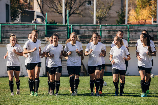 istock Women soccer team warming up together 1189318638