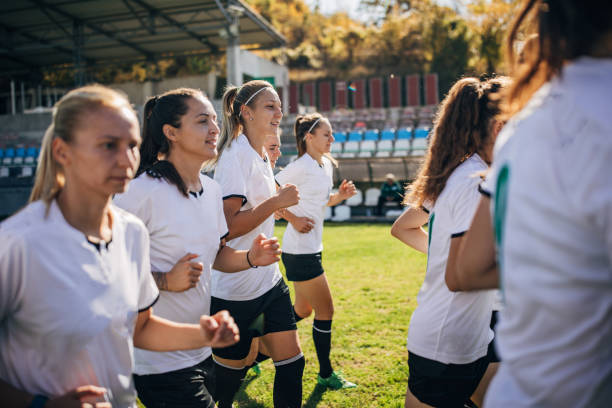 istock Ladies soccer team warming up together 1189319872