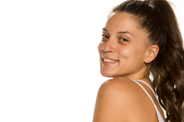istock Young smiling woman without makeup on white background 1189321547