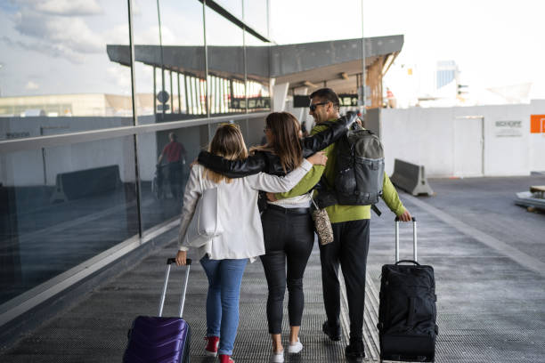 istock Cheerful friends at the airport 1189321908