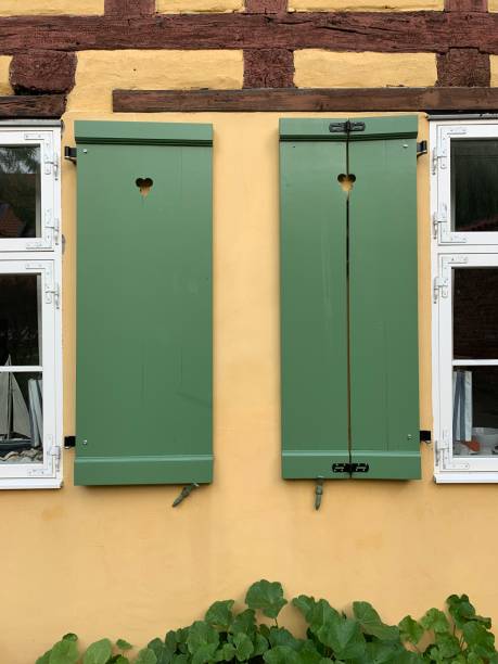 istock Green shutters on half timbered house 1189322769