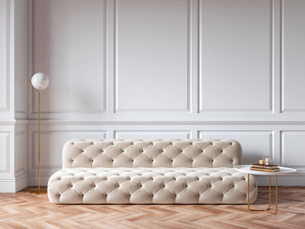 istock Classic white interior with capitone chester sofa, mouldings, wooden floor, floor lamp, coffee table. 3d render illustration mock up. 1189322937