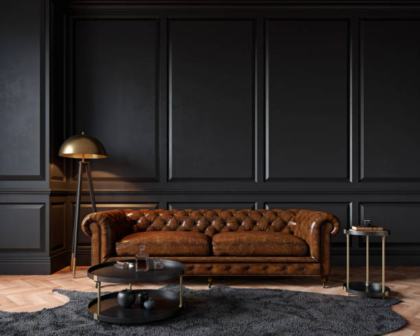 moderne klassische schwarze interieur mit capitone braun leder chester sofa, stehlampe, couchtisch, teppich, holzboden, formteile. 3d render innen mock up. - brown table inside stock-fotos und bilder