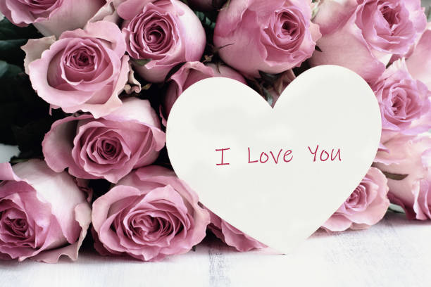 istock Beautiful Soft Pink Rose with Heart Background 1189322998