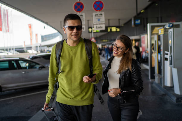 istock Happy couple at the airport 1189324607