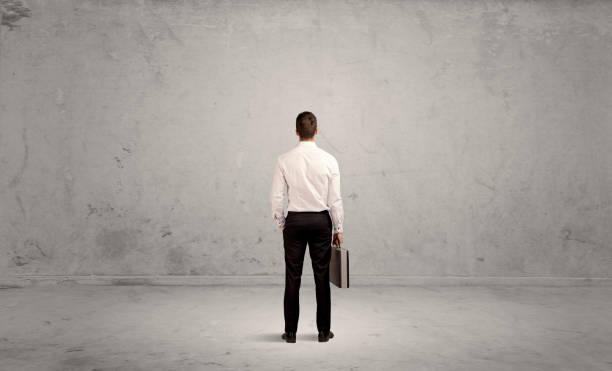 istock Businessman lost in empty urban space 1189325726