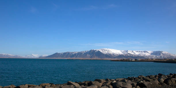 istock iceland nature with snow mountain ,lake and river 1189326617