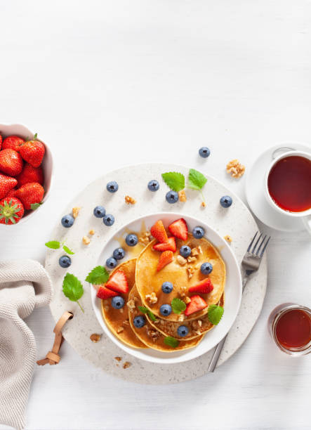 istock pancakes with blueberry strawberry honey and nuts for breakfast 1189328432