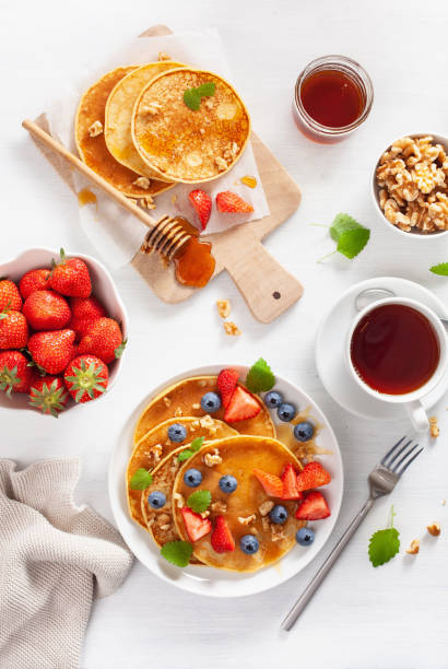 istock pancakes with blueberry strawberry honey and nuts for breakfast 1189328643