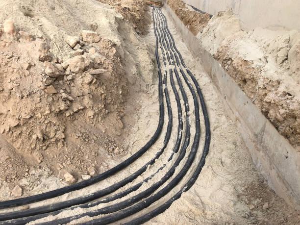 istock The high voltage electrical cable is laid in a trench 1189328776