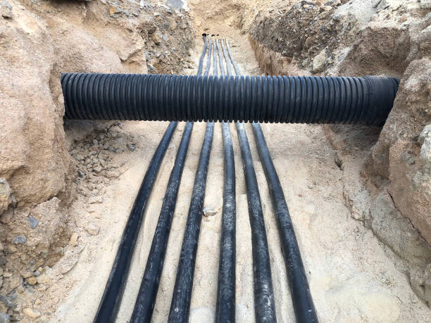 istock The high voltage electrical cable is laid in a trench 1189329049