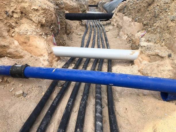 istock The high voltage electrical cable is laid in a trench 1189329051