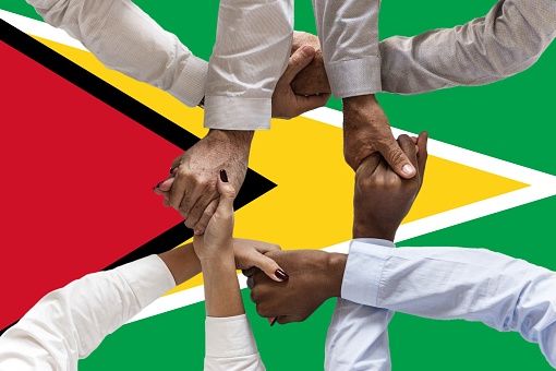 Flag of Guyana, intergration of a multicultural group of young people.