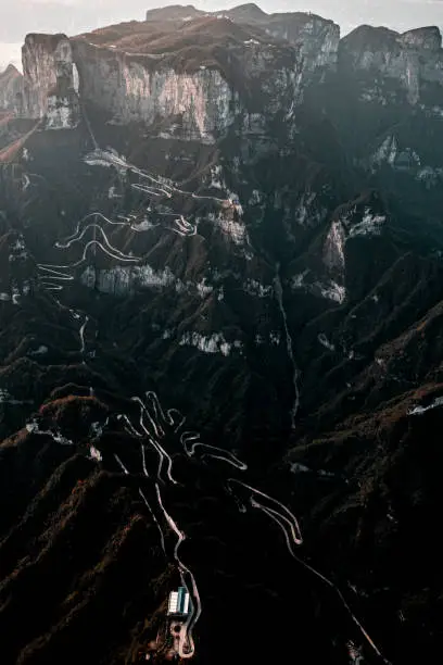 Photo of Long slithering curvy mountain road of Zhangjiajie (张家界), on the Tianmen mountain (天门山), China, taken from a helicopter