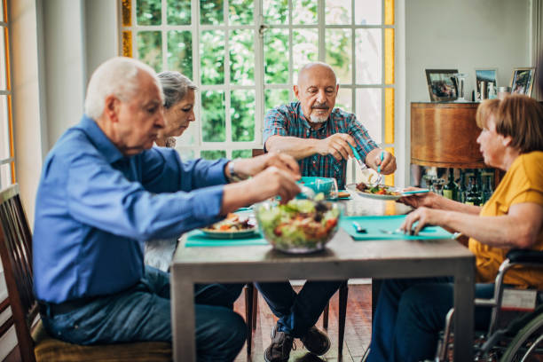 istock Senior friends having dinner together 1189331091