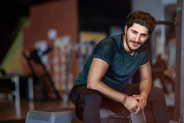 istock Happy smiling man in gym 1189332040
