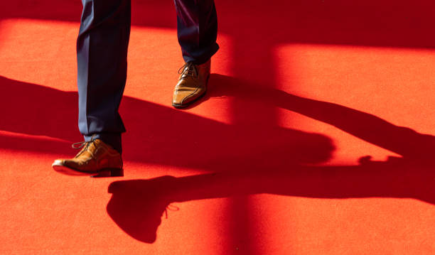 istock Low Section Of Man Walking On Floor 1189333287