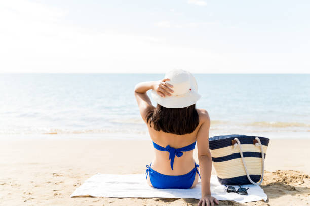 istock Woman Relaxing On Sea Shore At Beach 1189333462