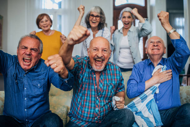 istock Senior friends watching sports match 1189333570