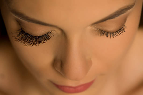 istock comaprison of natural and extended eyelashes 1189335472