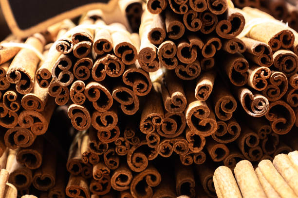 Cinnamon swirls background, top view