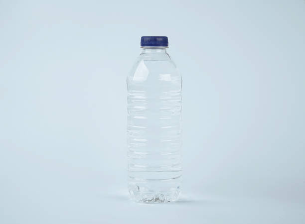 istock Water in plastic bottle on isolated white background 1189338437