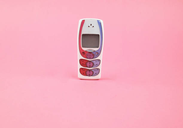 Many mobile phones on a wooden background