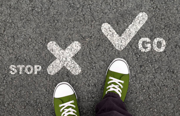 istock Boy in green shoes trying to move forward 1189340753