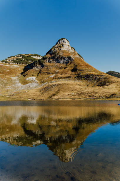 istock View of lake with mountain reflected in water 1189342531