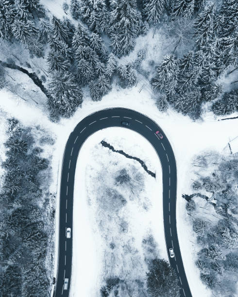 istock Snowy curved street from above in winter 1189344410