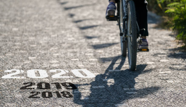 istock Bicycle on asphalt road. New Year 2020 concept 1189346572