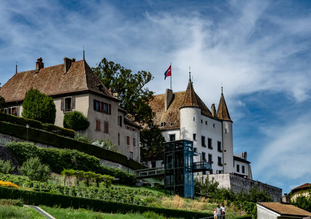 The Château de Spiez (Schloss Spiez) with garden view. This medieval fortress is situated by the picturesque Lake thurn in the small town of Spiez in the Canton of Bern, Switzerland. It is a national heritage site in Switzerland.