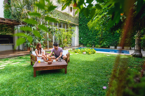 istock Young Couple Enjoying Light Breakfast in Backyard 1189350262