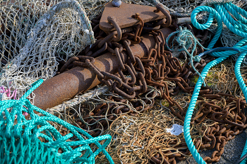 nets, rusty chains and ropes, equipment on a fishing boat