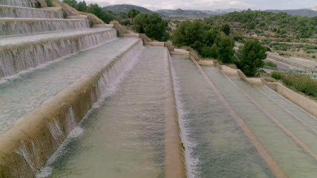 Water steps side view drone rising