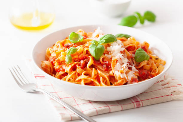 istock tagliatelle pasta with tomato sauce parmesan basil 1189352148