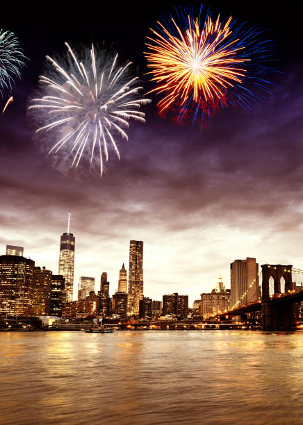 istock Fireworks on NYC Skyline and Brooklyn Bridge, Manhattan Financial District. 1189352234