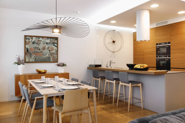 Interior of a dining area with kitchen in a modern residential apartment